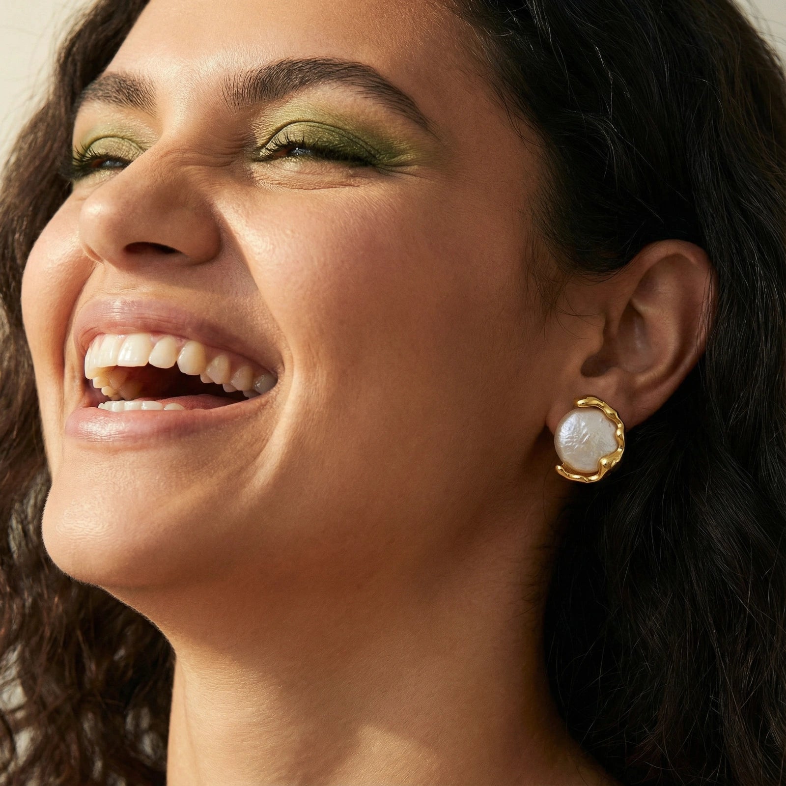 Lifestyle view of Pearl Embrace Stud Earrings by Averuna Jewellery