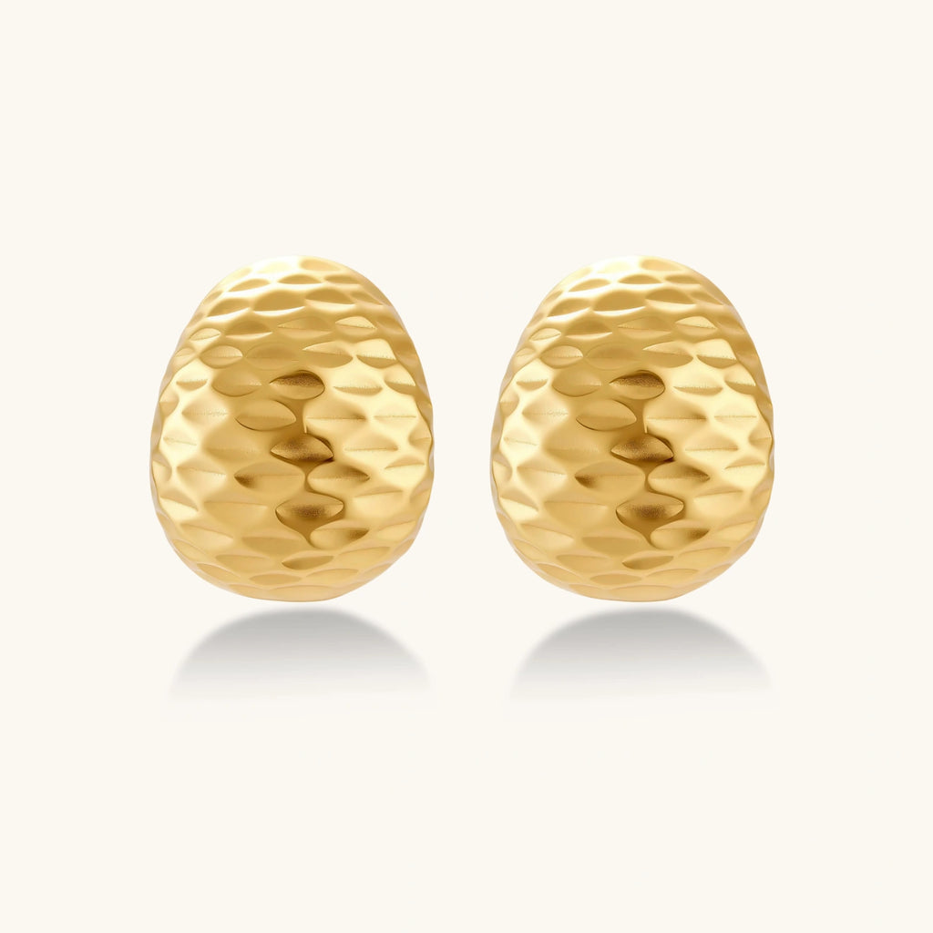 Close-up detail of Hammered Gold Huggie Earrings by Averuna Jewellery