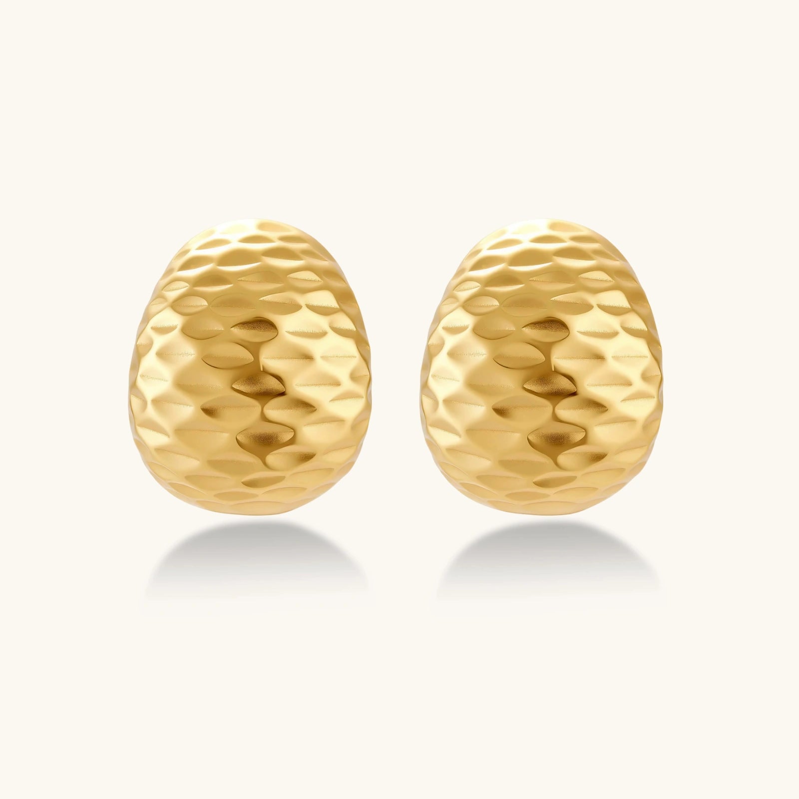 Close-up detail of Hammered Gold Huggie Earrings by Averuna Jewellery