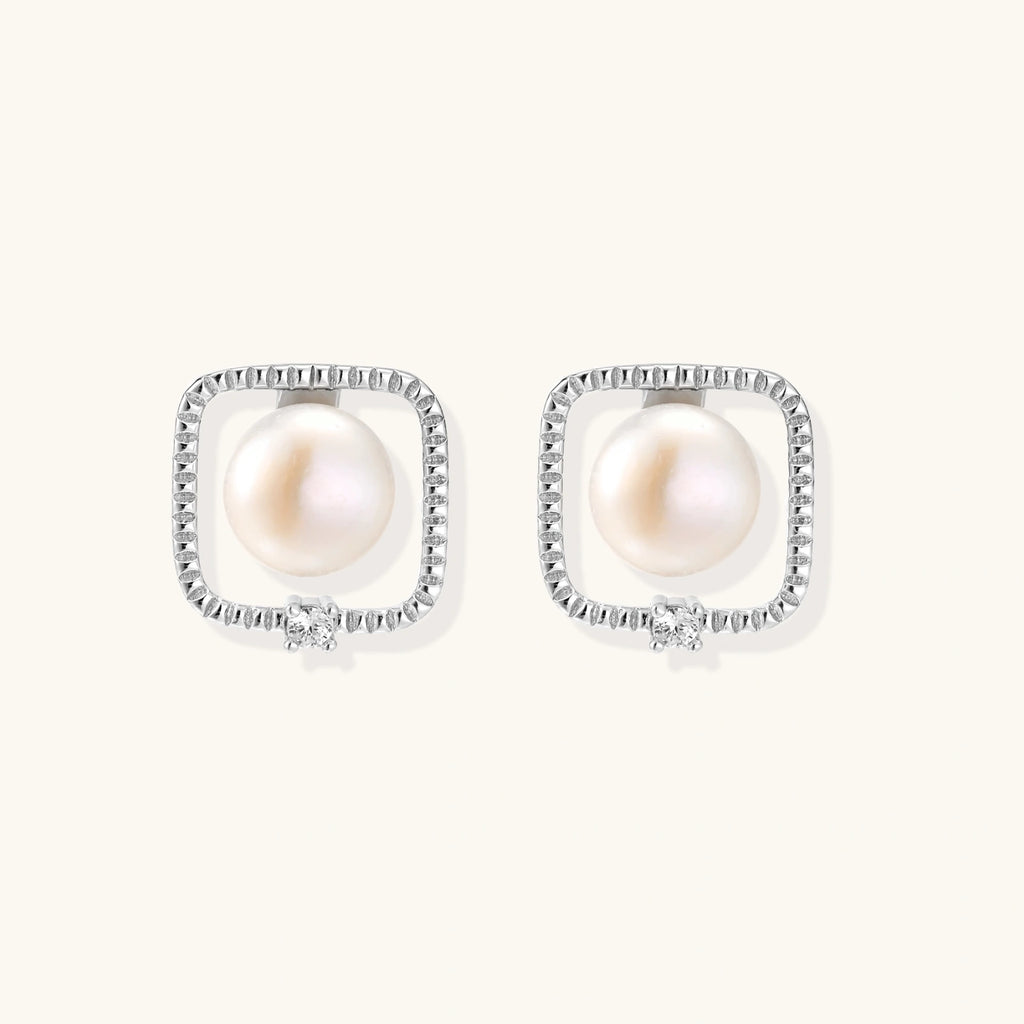 Angled view of Pearl Halo Stud Earrings by Averuna Jewellery