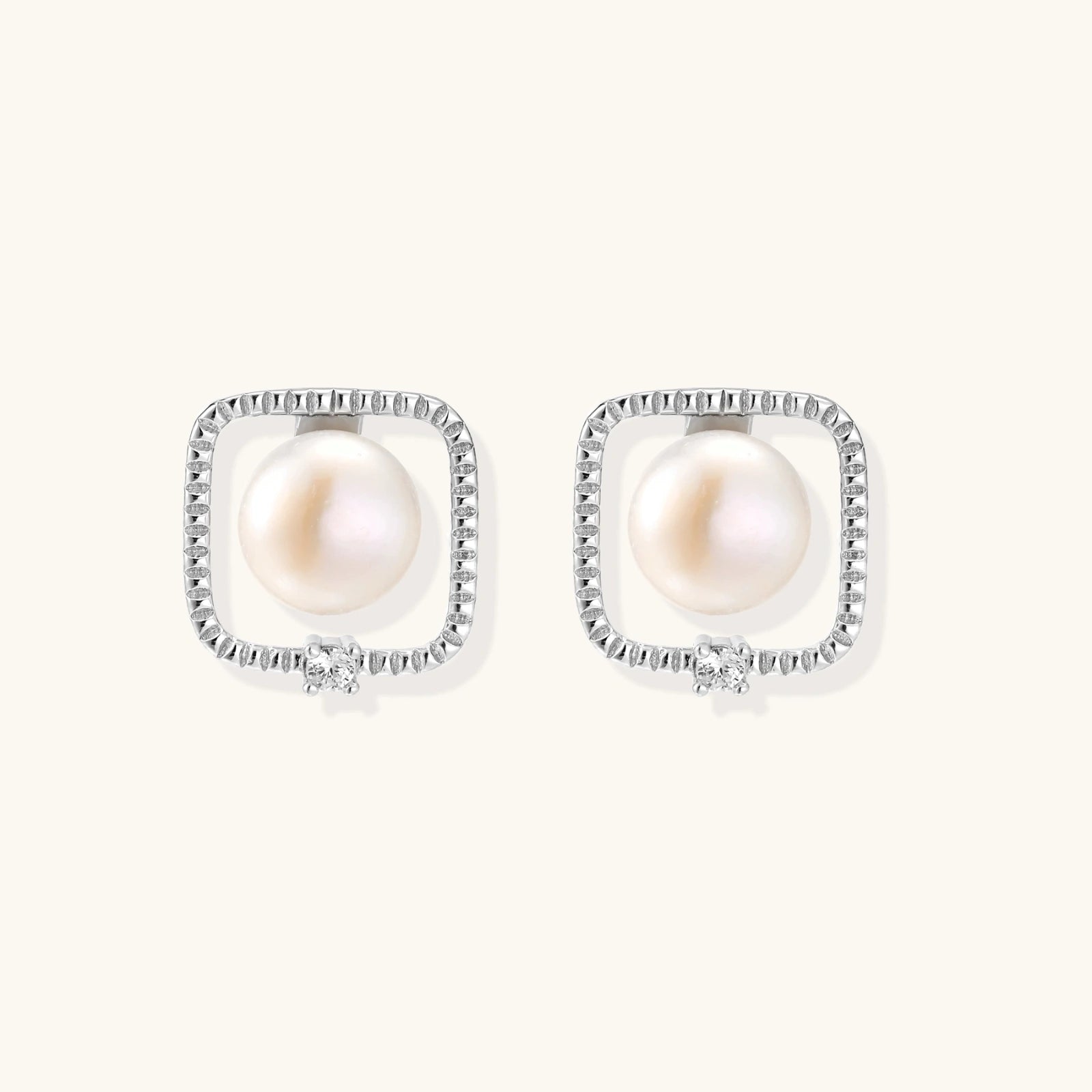 Angled view of Pearl Halo Stud Earrings by Averuna Jewellery