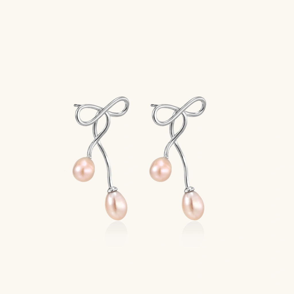 Angled view of Ethereal Pearl Drop Earrings by Averuna Jewellery