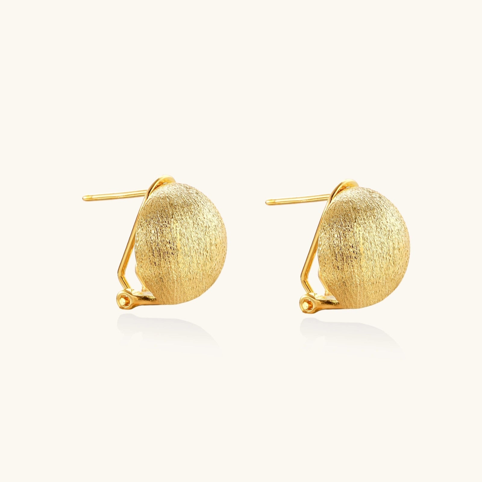 Close-up detail of Brushed Gold Dome Clip Earrings by Averuna Jewellery