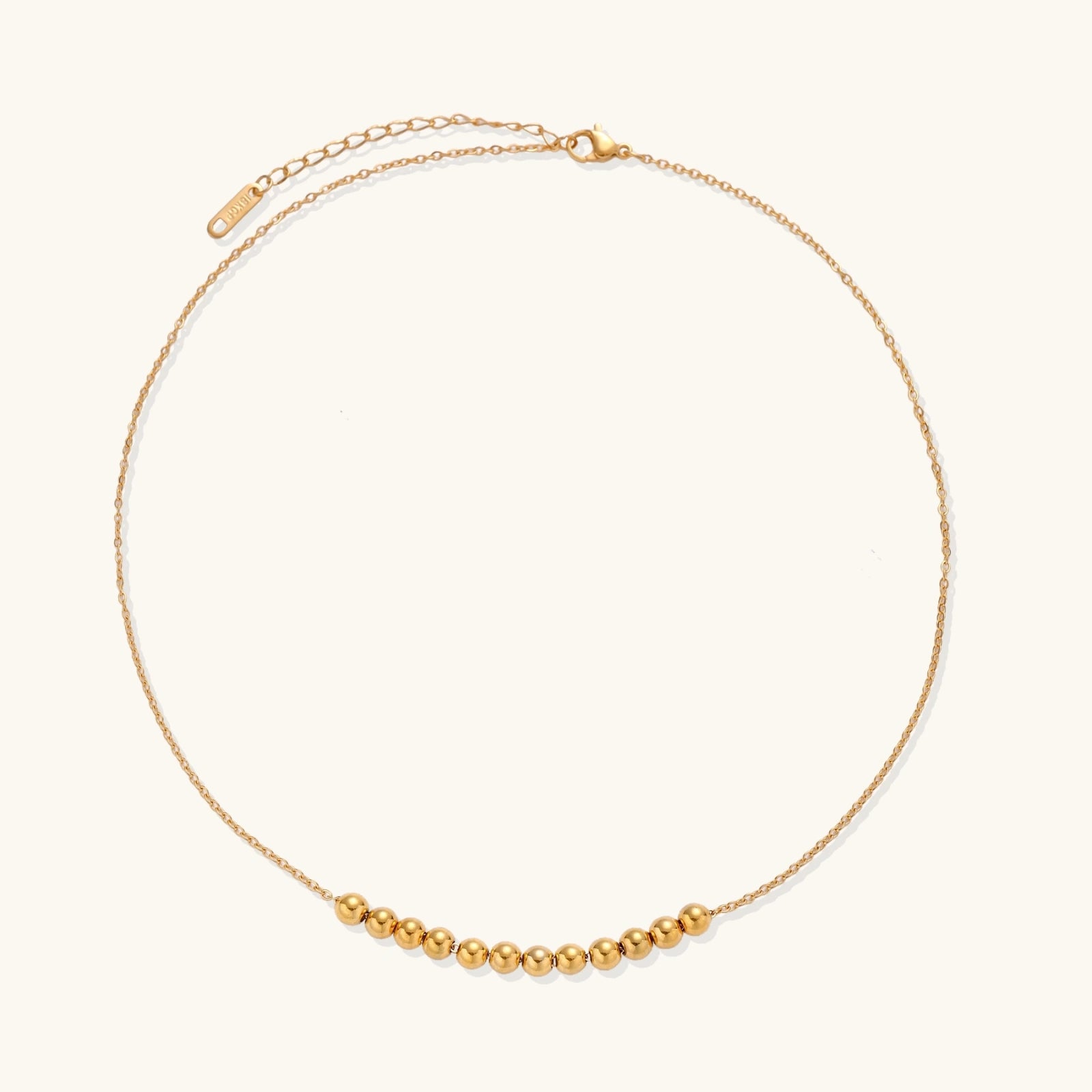 Angled view of Golden Sphere Necklace by Averuna Jewellery
