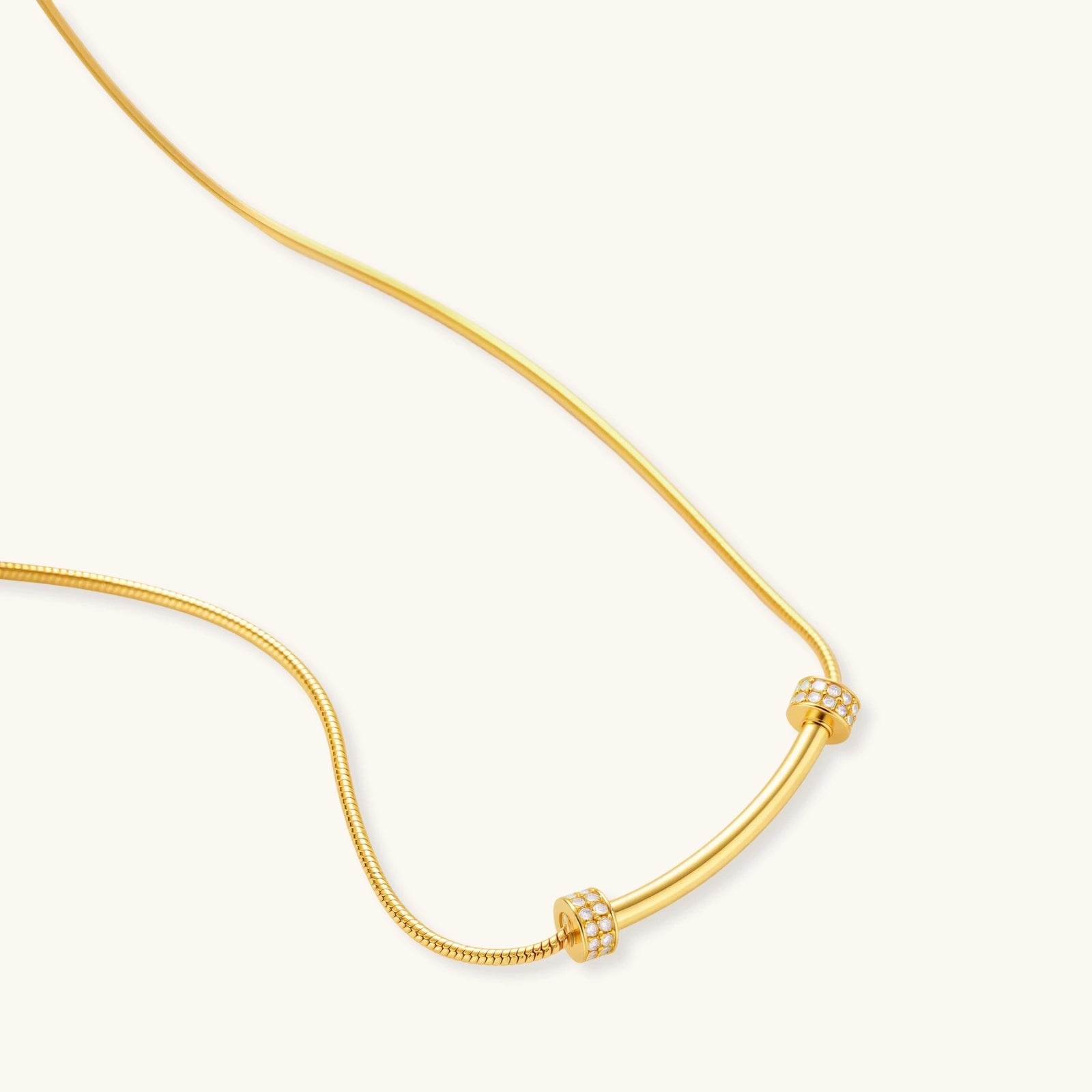 Angled view of Curved Spark Bar Necklace by Averuna Jewellery