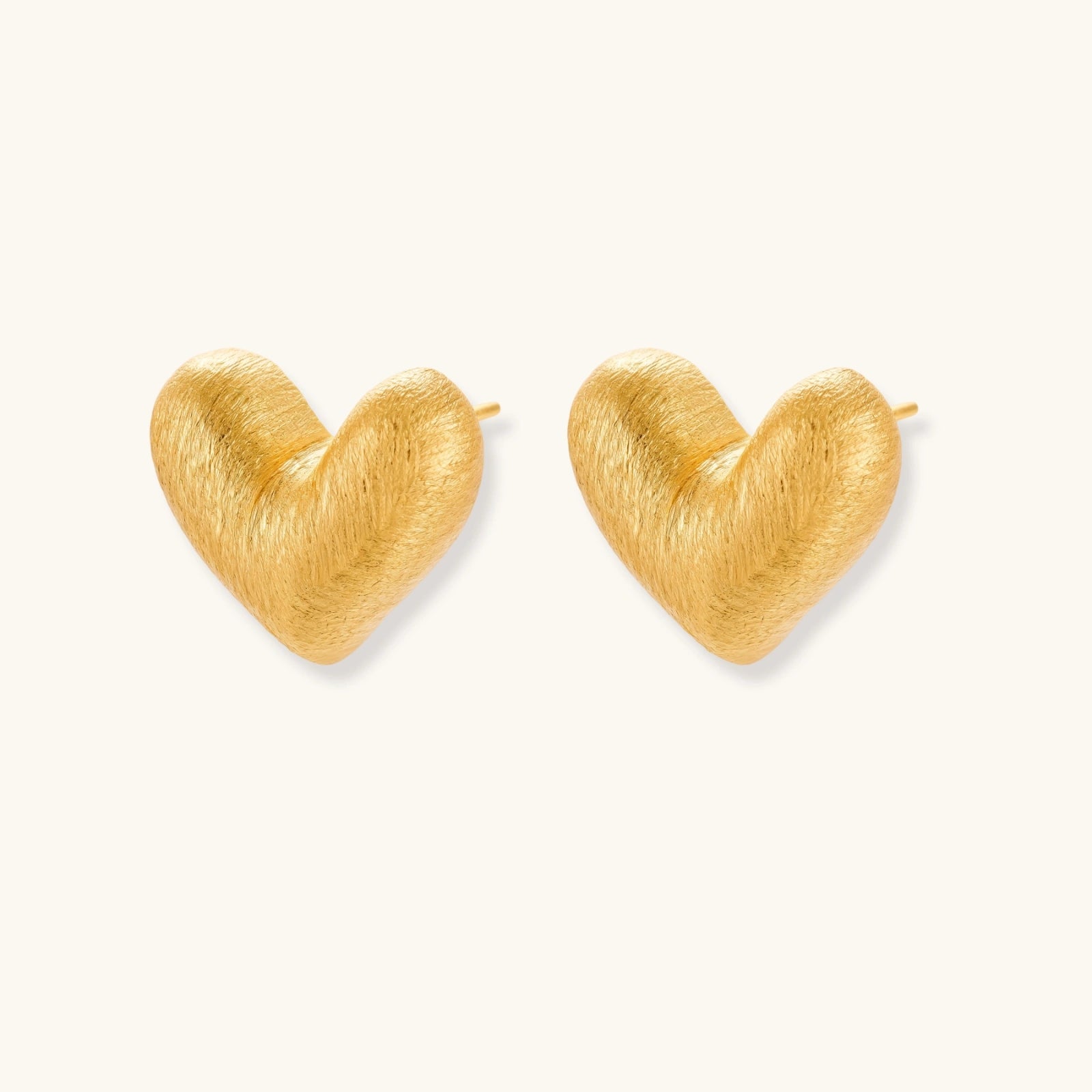 Angled view of Brushed Heart Stud Earrings by Averuna Jewellery