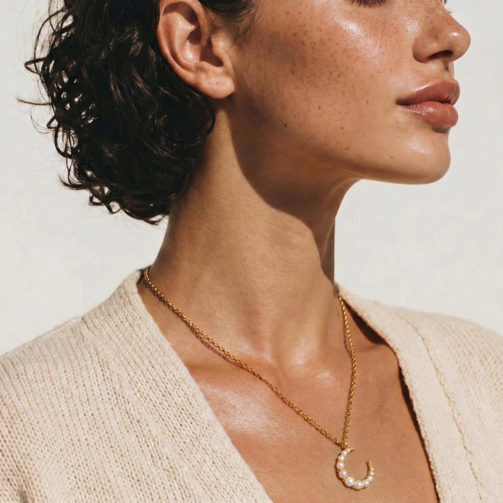 Lifestyle view of Luna Pearl Crescent Necklace by Averuna Jewellery