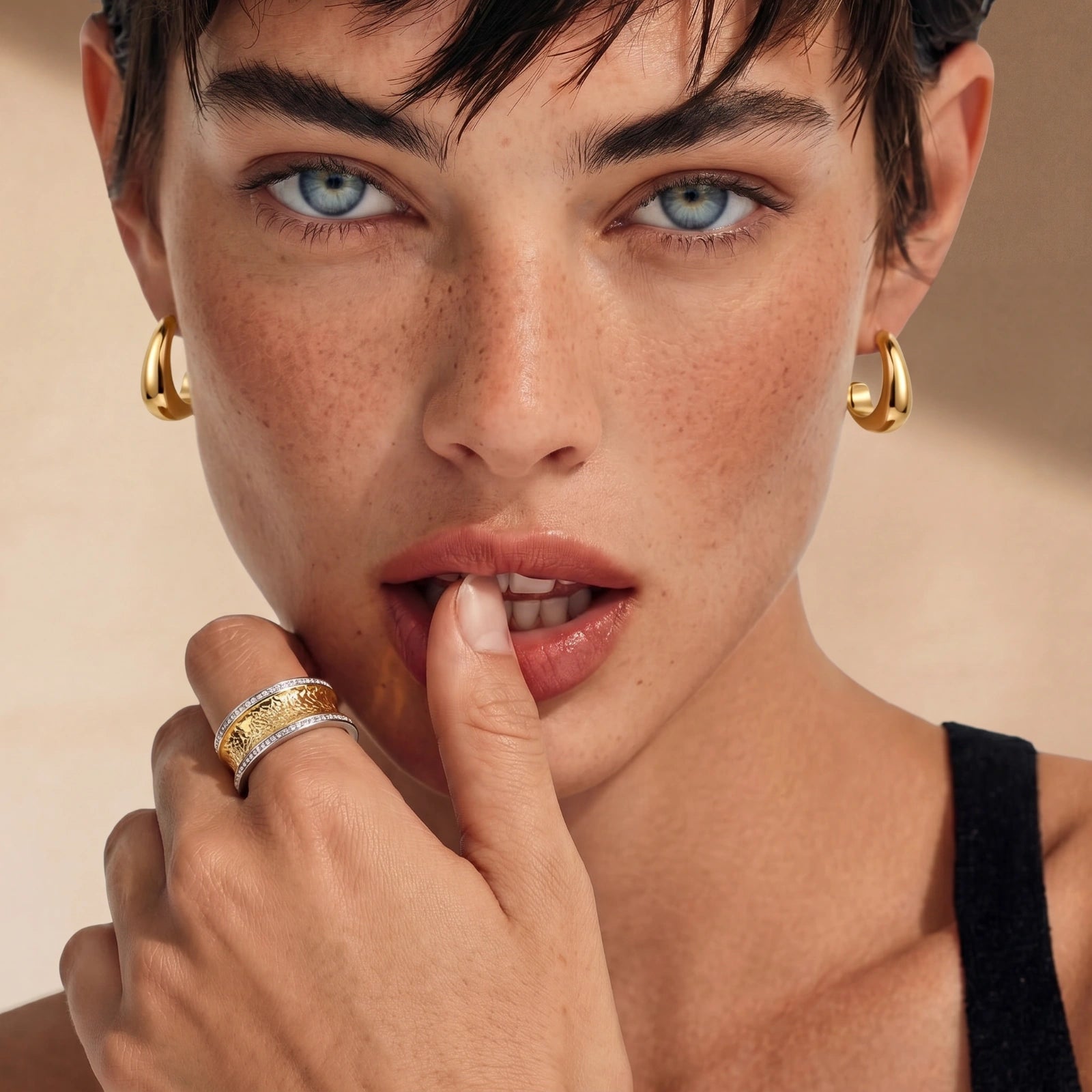 Lifestyle view of Sculpted Curve Huggie Earrings by Averuna Jewellery